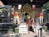 
Kathmandu Valley Sankhu Vajrayogini Temple Entrance With Two White Snow Lions, Bells and Torana Door
